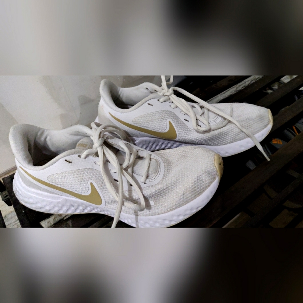 Nike Revolution white and gold running shoes